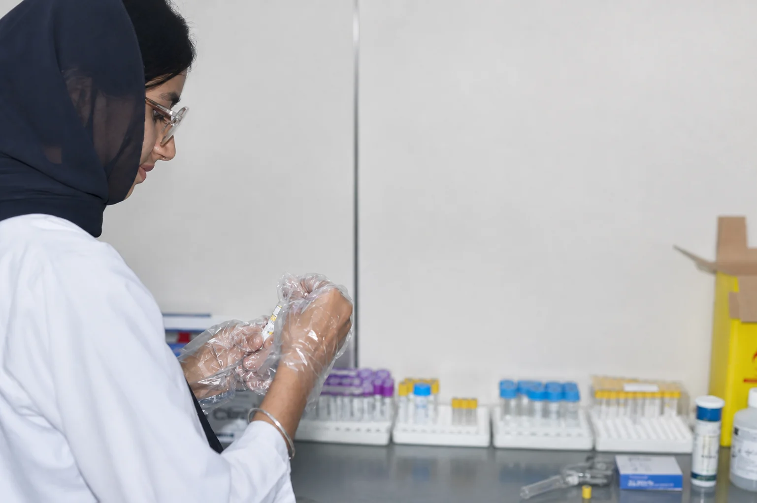 YMC laboratory professional preparing clinical samples